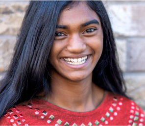 Young tween smiling wide