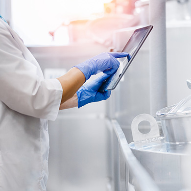 Close up of a doctor using a tablet